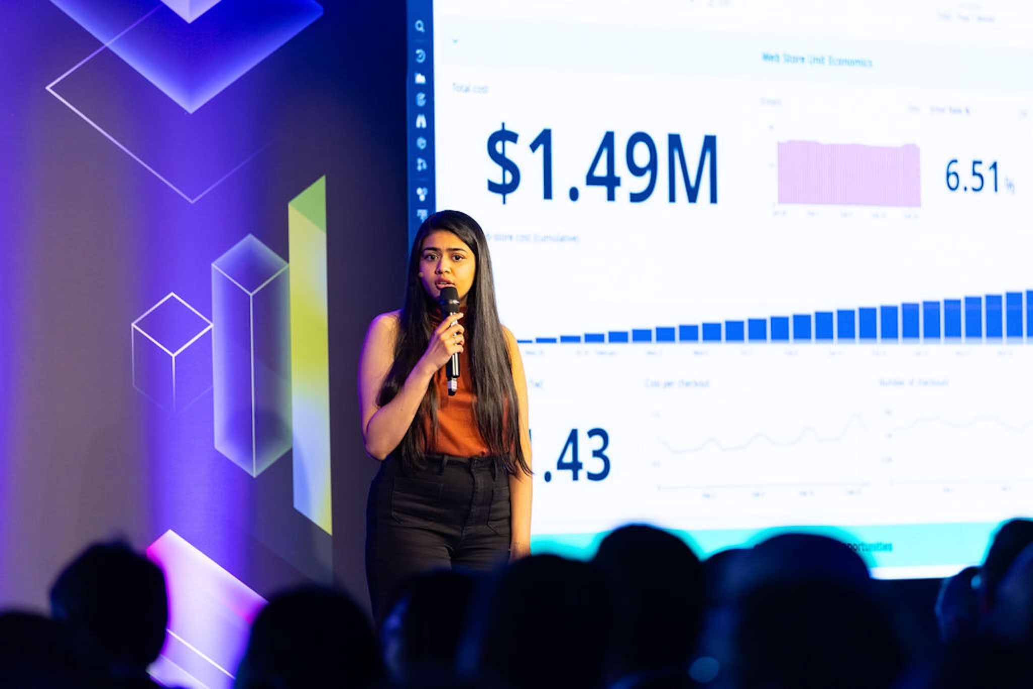 A presenter speaks on stage during a Datadog Summit keynote.