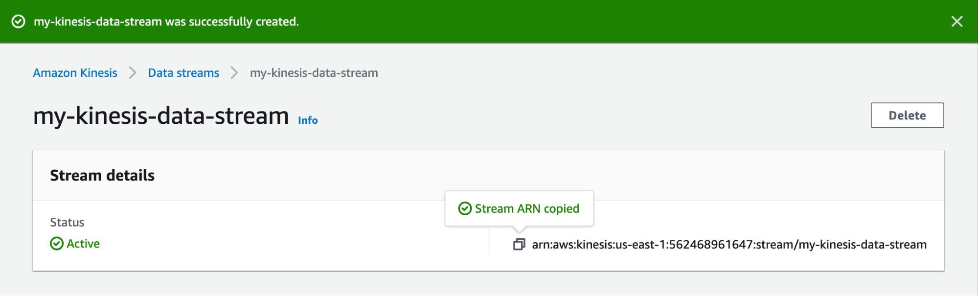 A Kinesis web page shows a banner stating that the stream was successfully created, and acknowledges that that stream’s ARN has been copied to the user’s clipboard.
